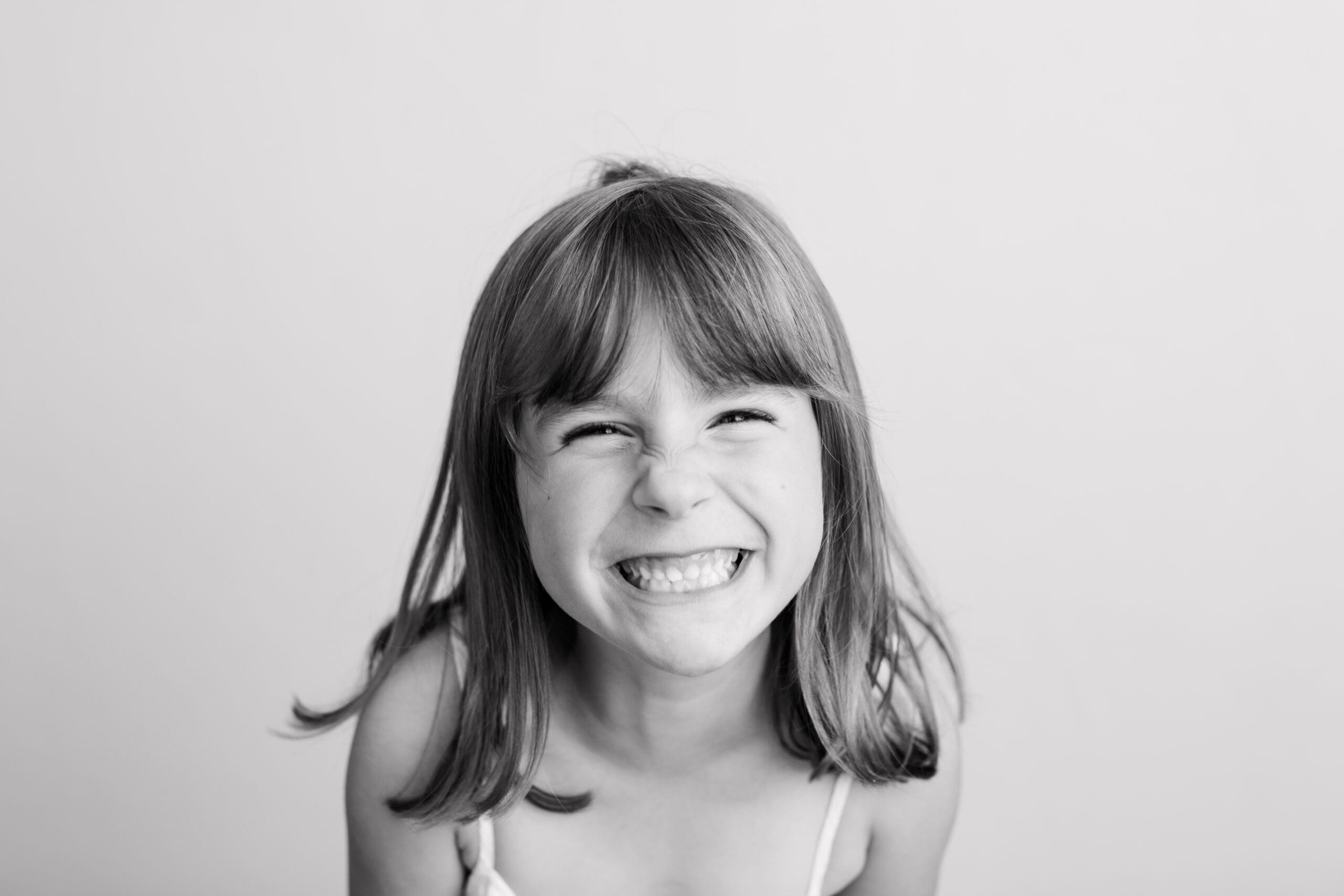 black and white personality portrait kid smiling big