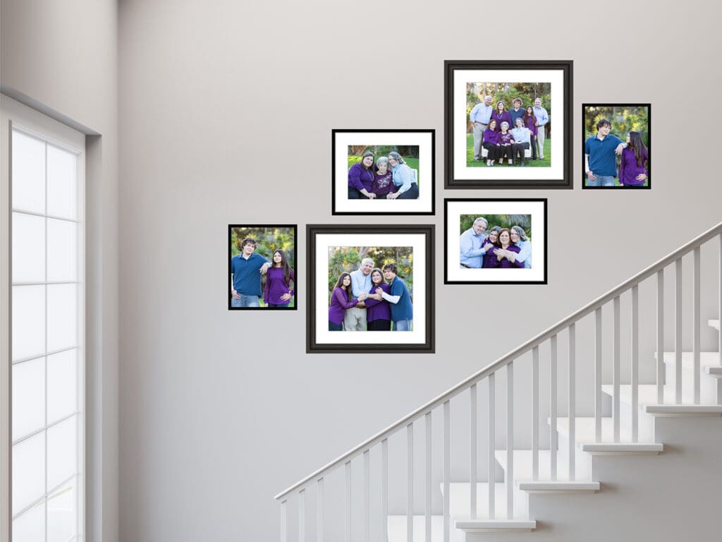 family portraits framed going up a staircase wall